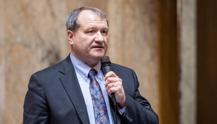 Senator Leonard Christian speaks on the House floor in archive photo from his website.