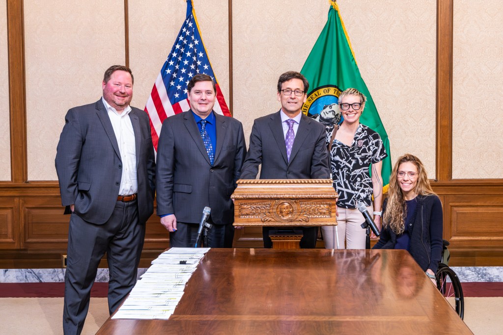 DRW staff with Gov Ferguson at bill signing